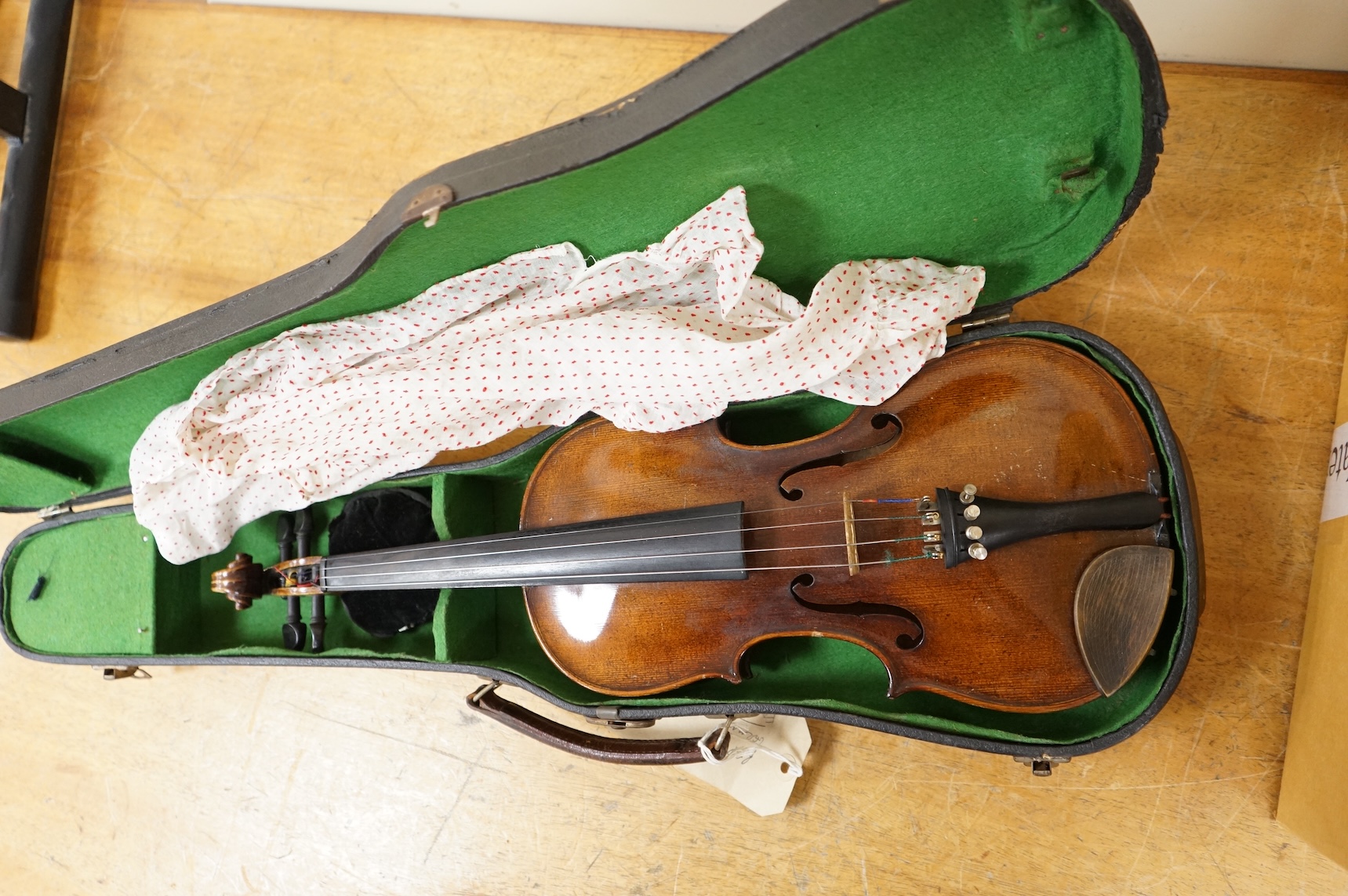 A late 19th century violin, with label for J.B. Schweitzer, 7/8 size, no bow, in case